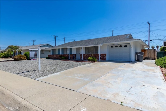 28590 Middlebury Way, Menifee, CA 92586 - ranch-style house featuring a garage, concrete driveway, fence, covered porch, and roof with shingles