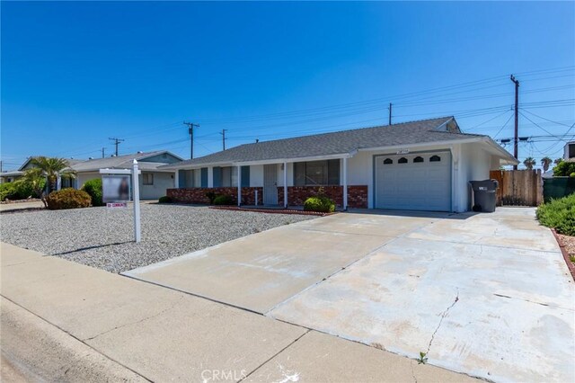 28590 Middlebury Way, Menifee, CA 92586 - ranch-style home with an attached garage, concrete driveway, a porch, and roof with shingles