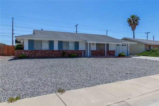 28590 Middlebury Way, Menifee, CA 92586 - ranch-style house with an attached garage, driveway, brick siding, and roof with shingles