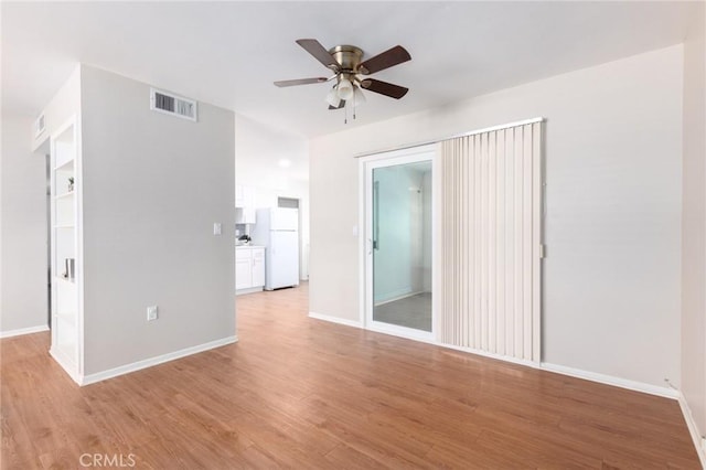 28590 Middlebury Way, Menifee, CA 92586 - spare room featuring a ceiling fan, baseboards, and light wood-type flooring
