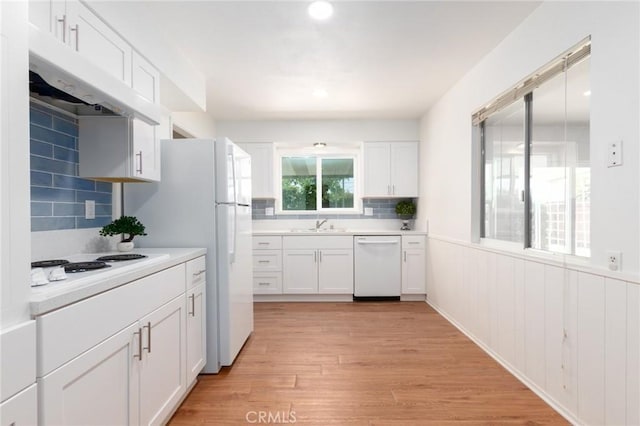 28590 Middlebury Way, Menifee, CA 92586 - kitchen featuring white appliances, light countertops, white cabinetry, decorative backsplash, and light wood-style flooring