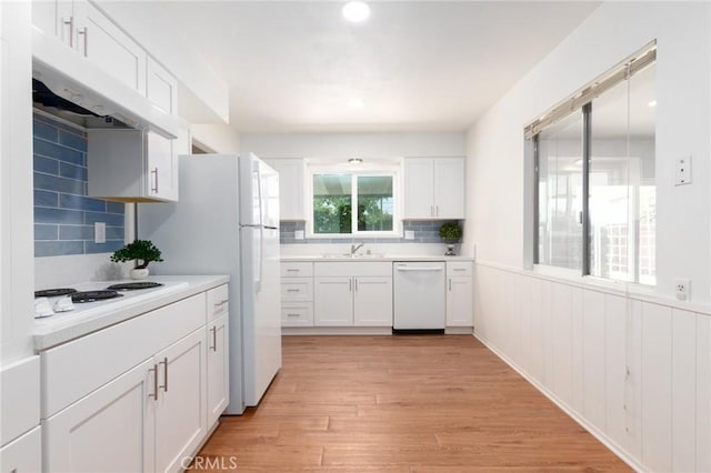 28590 Middlebury Way, Menifee, CA 92586 - kitchen featuring white appliances, light countertops, white cabinets, backsplash, and a wainscoted wall