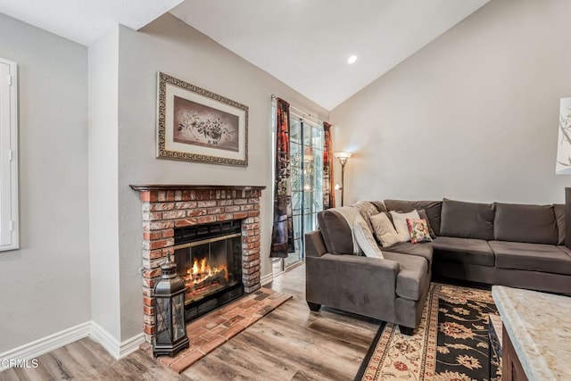 2752 Lemon Dr, Simi Valley, CA 93063 - living area featuring light wood-type flooring, a fireplace, vaulted ceiling, and recessed lighting