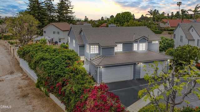 2752 Lemon Dr, Simi Valley, CA 93063 - traditional-style home featuring an attached garage, asphalt driveway, and a residential view