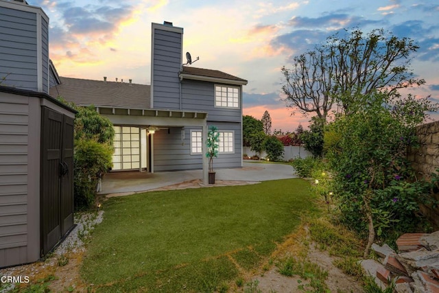 2752 Lemon Dr, Simi Valley, CA 93063 - back of property with a patio area and a chimney