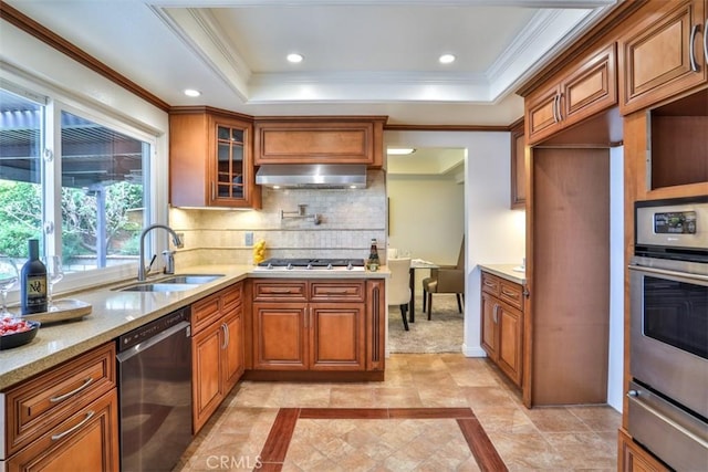 kitchen featuring a sink, a warming drawer, stainless steel appliances, and brown cabinets