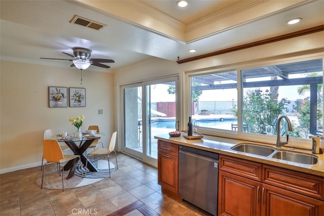 kitchen with a sink, ornamental molding, brown cabinets, and dishwasher