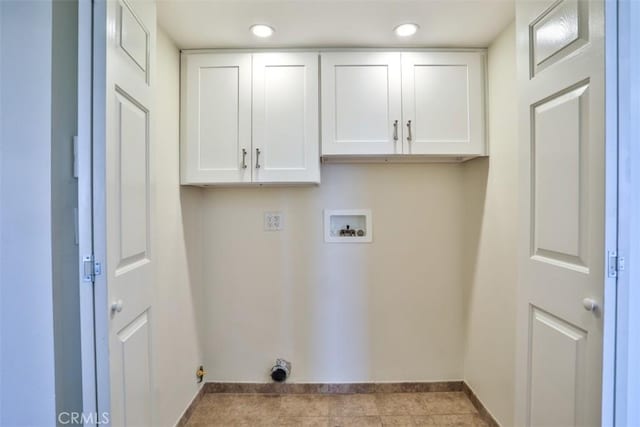 laundry area with baseboards, hookup for a washing machine, cabinet space, and recessed lighting