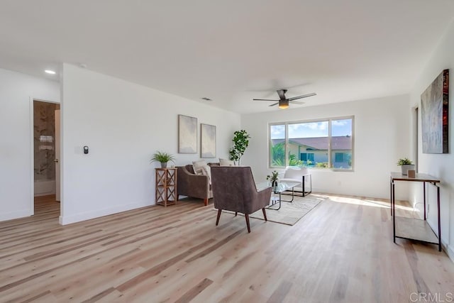 sitting room with light wood-style flooring, baseboards, a ceiling fan, and recessed lighting