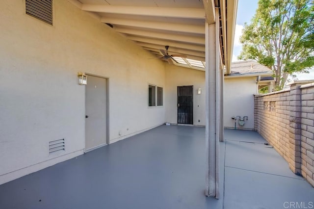 view of patio featuring ceiling fan and visible vents