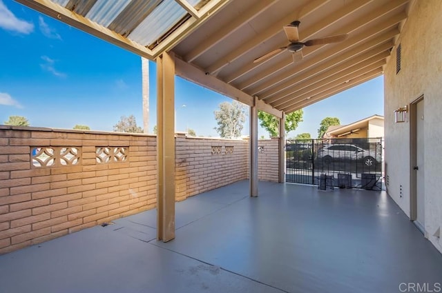 view of patio / terrace featuring fence and ceiling fan