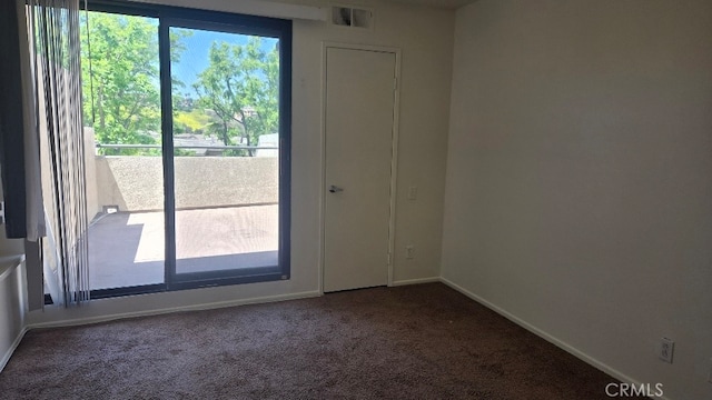 13104 Glen Ct Unit 46, Chino Hills, CA 91709 - spare room featuring dark carpet, baseboards, and visible vents