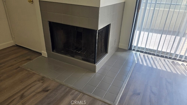 13104 Glen Ct Unit 46, Chino Hills, CA 91709 - interior details with a multi sided fireplace and wood finished floors