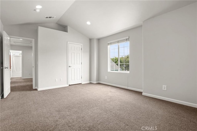 unfurnished bedroom featuring lofted ceiling, baseboards, carpet floors, and recessed lighting