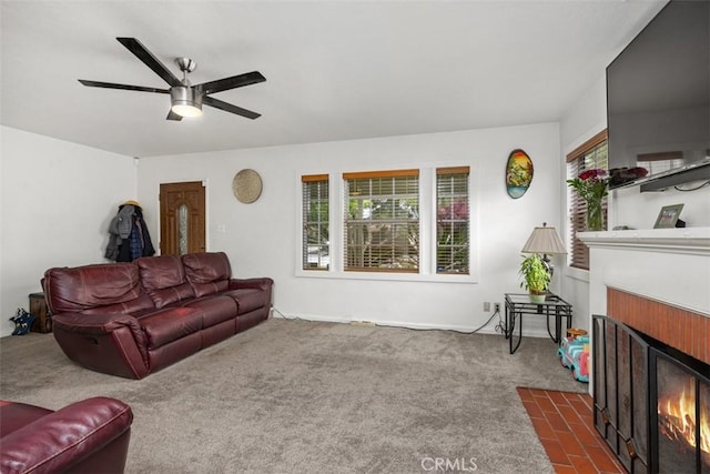 3432 N Arrowhead Ave, San Bernardino, CA 92405 - living area featuring a tiled fireplace, dark carpet, and ceiling fan