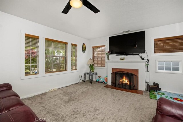 3432 N Arrowhead Ave, San Bernardino, CA 92405 - living room with a ceiling fan, carpet, and a fireplace