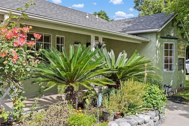 3432 N Arrowhead Ave, San Bernardino, CA 92405 - view of home's exterior with stucco siding and a shingled roof