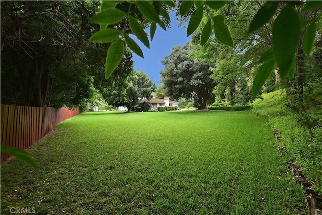 view of yard with fence