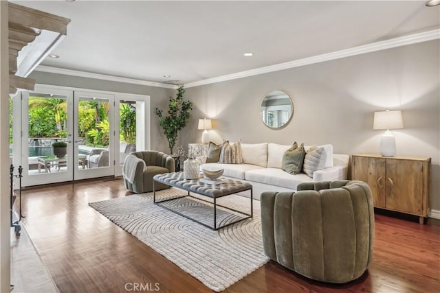 living area featuring ornamental molding, wood finished floors, and recessed lighting