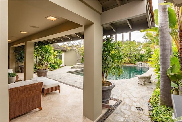 outdoor pool featuring a patio area