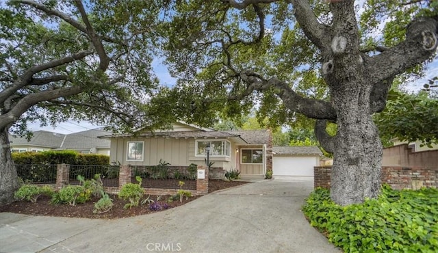 6833 Sultana Ave, San Gabriel, CA 91775 - view of front of home with concrete driveway and board and batten siding