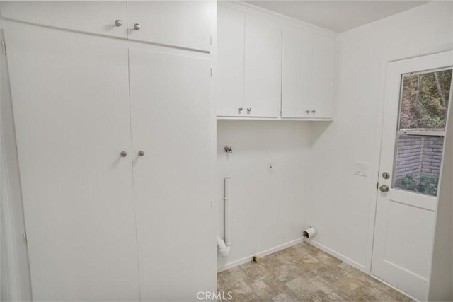 6833 Sultana Ave, San Gabriel, CA 91775 - laundry room with cabinet space and baseboards