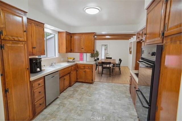 6833 Sultana Ave, San Gabriel, CA 91775 - kitchen featuring stainless steel dishwasher, brown cabinets, and light countertops