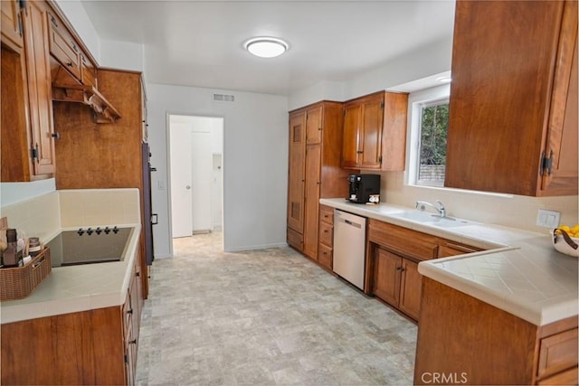 6833 Sultana Ave, San Gabriel, CA 91775 - kitchen with dishwasher, tile countertops, backsplash, and brown cabinets