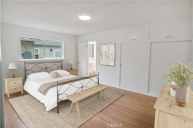 6833 Sultana Ave, San Gabriel, CA 91775 - bedroom featuring wood finished floors and connected bathroom
