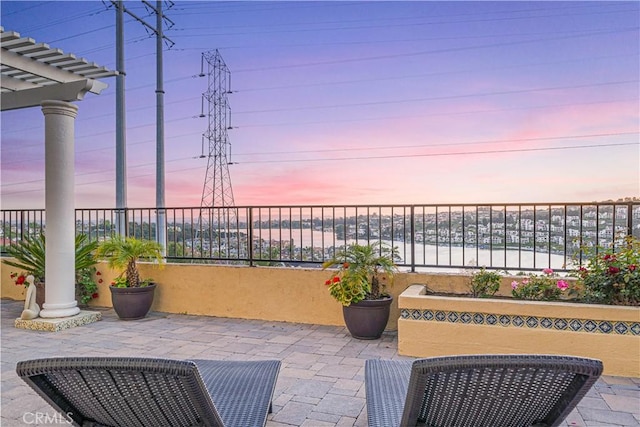 view of patio terrace at dusk