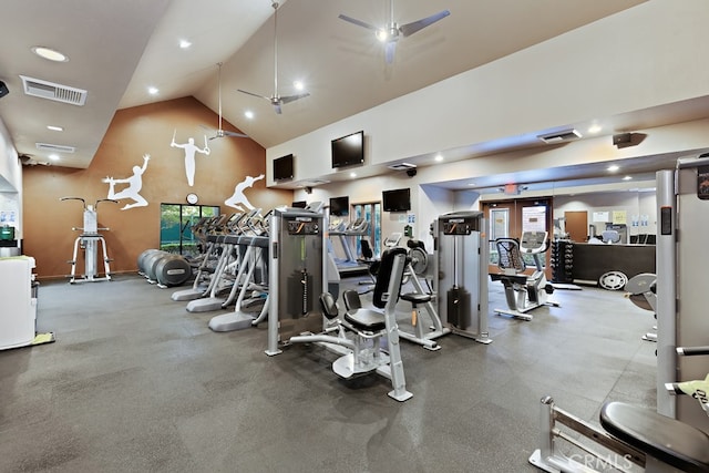 exercise room with visible vents and high vaulted ceiling