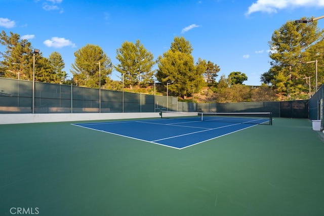view of sport court featuring fence and community basketball court