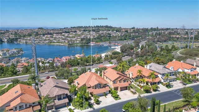 bird's eye view featuring a residential view and a water view