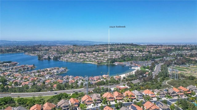 bird's eye view featuring a water view and a residential view