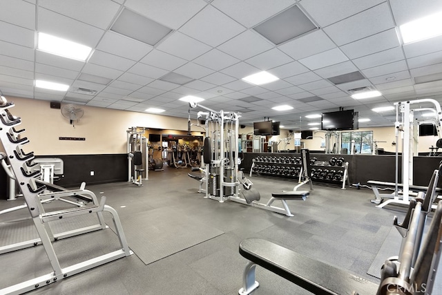 workout area featuring a paneled ceiling