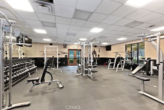 exercise room with a drop ceiling