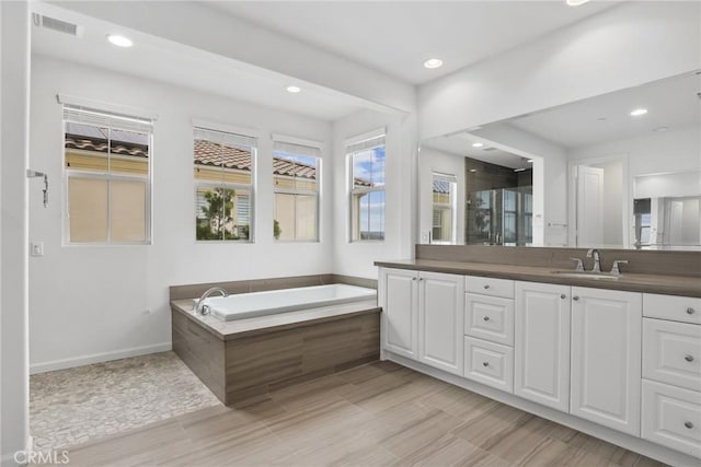 676 E Desert Willow Rd, Azusa, CA 91702 - full bath featuring a bath, visible vents, baseboards, recessed lighting, and vanity