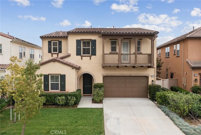 676 E Desert Willow Rd, Azusa, CA 91702 - mediterranean / spanish-style home featuring stucco siding, a tile roof, and concrete driveway