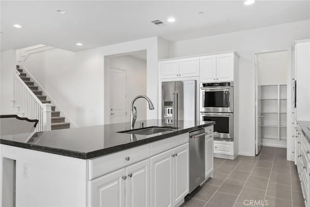 676 E Desert Willow Rd, Azusa, CA 91702 - kitchen featuring visible vents, a sink, a kitchen island with sink, appliances with stainless steel finishes, and white cabinetry