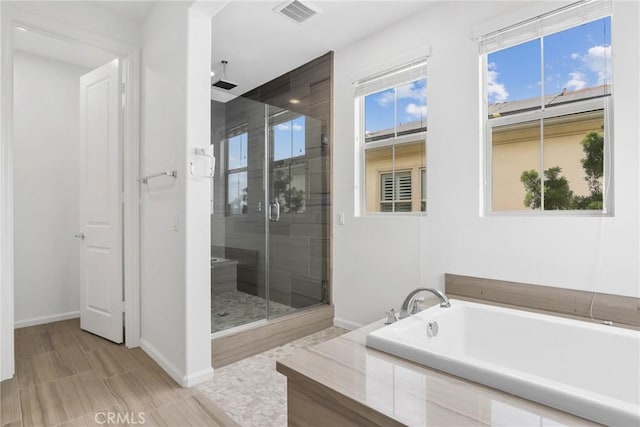676 E Desert Willow Rd, Azusa, CA 91702 - full bath featuring a bath, baseboards, visible vents, and a shower stall