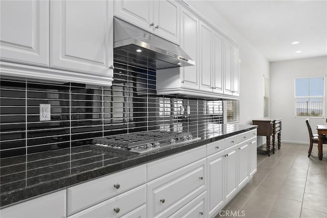 676 E Desert Willow Rd, Azusa, CA 91702 - kitchen featuring stainless steel gas stovetop, light tile patterned floors, white cabinetry, backsplash, and under cabinet range hood