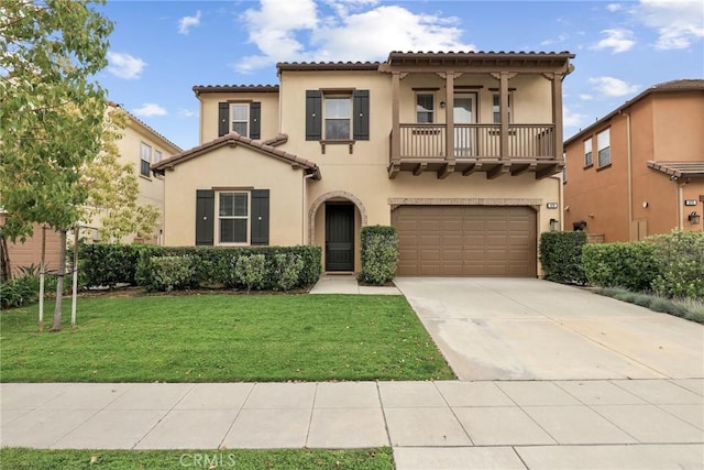 676 E Desert Willow Rd, Azusa, CA 91702 - mediterranean / spanish house with a tiled roof, a balcony, stucco siding, driveway, and a garage