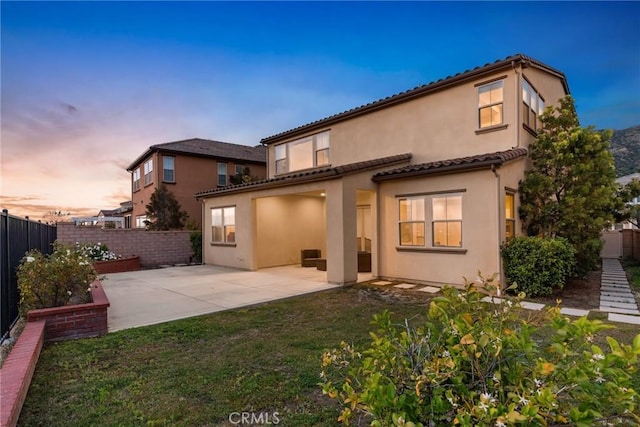 676 E Desert Willow Rd, Azusa, CA 91702 - back of house with a tiled roof, a fenced backyard, a yard, a patio, and stucco siding