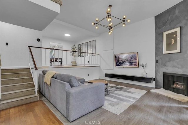 10201 Mason Ave Unit 115, Chatsworth, CA 91311 - living area with a chandelier, wood finished floors, and stairway