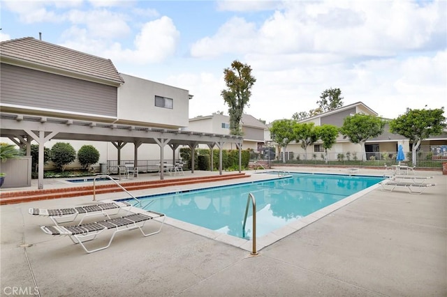 10201 Mason Ave Unit 115, Chatsworth, CA 91311 - community pool featuring a patio area, a pergola, and fence