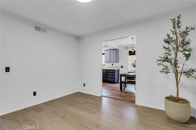 10201 Mason Ave Unit 115, Chatsworth, CA 91311 - spare room with wood finished floors and baseboards