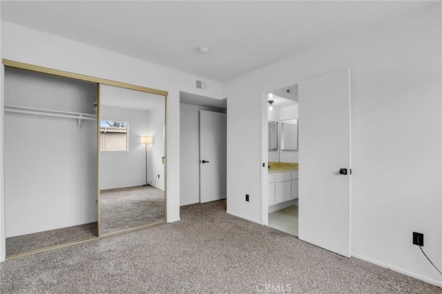 10201 Mason Ave Unit 115, Chatsworth, CA 91311 - unfurnished bedroom with carpet flooring, a closet, and ensuite bathroom