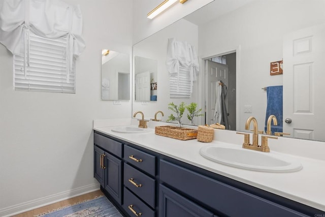 17236 Eagle Canyon Way, San Diego, CA 92127 - bathroom with double vanity, wood finished floors, and baseboards