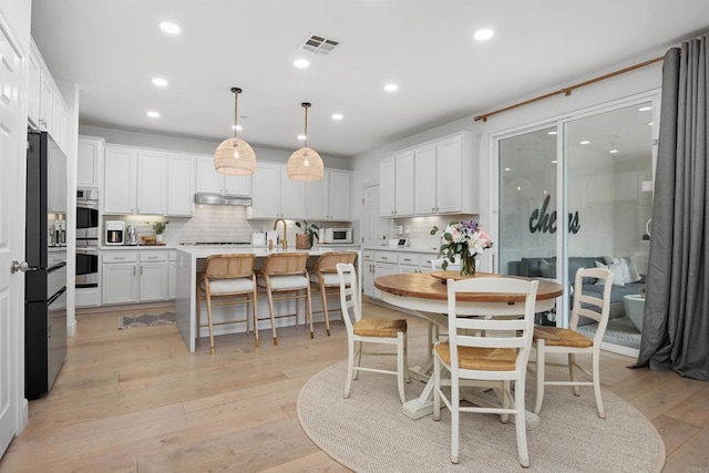 17236 Eagle Canyon Way, San Diego, CA 92127 - dining space with recessed lighting and light wood-style floors