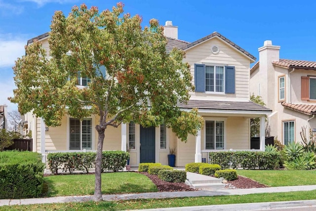 17236 Eagle Canyon Way, San Diego, CA 92127 - obstructed view of property featuring a tiled roof, a front lawn, a chimney, and covered porch